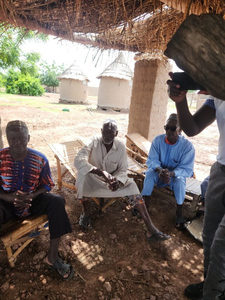 Meeting of the village elders to discuss the school project